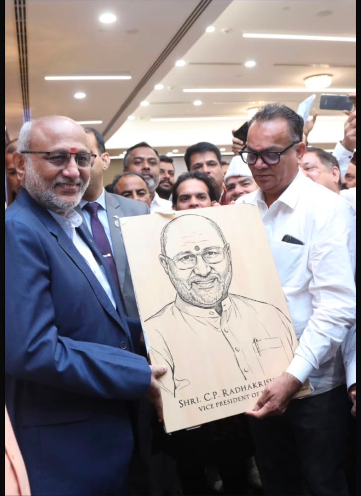 Chapter Gifting — wooden portrait presented to Shri C.P. Radhakrishnan, Vice President of India